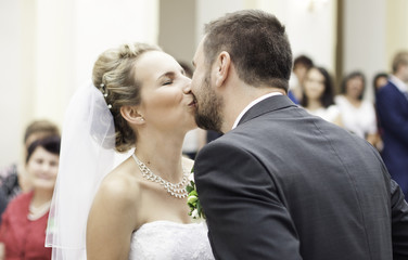Bride´s and groom´s first kiss,  wedding ceremony