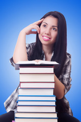 Girl student with books on white