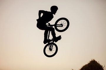 Extreme rider making a bike jump
