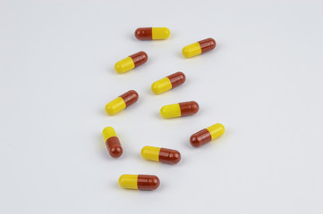 Yellow and red capsules isolated