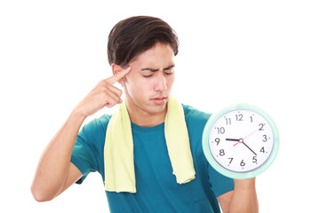 時計を持つ悩む男性
