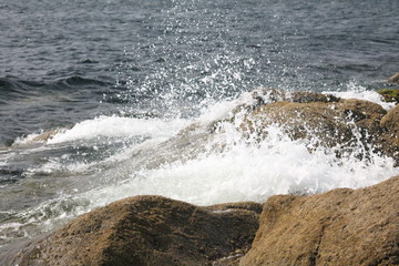 waves crashing against a rocky shore