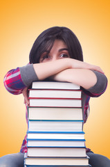 Girl student with books on white