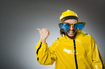 Man wearing yellow suit in funny concept