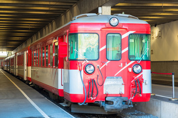 Naklejka premium Red train at the Zermatt train station 