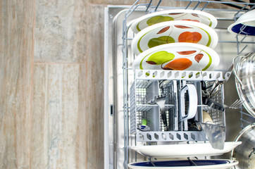 chores, clean dishes and cutlery in the dishwasher