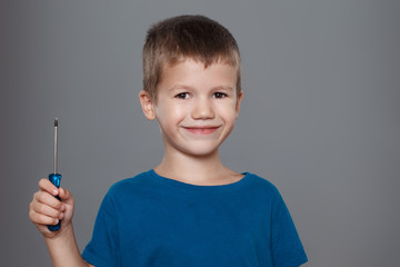 Little boy holding screwdriver