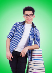 Student with lots of books on white