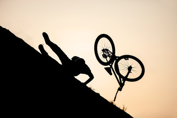 Extreme rider falling while performing a bike jump