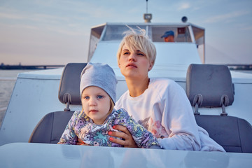 Mother, daughter on yacht or catamaran boat