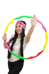 A girl in sport suit with hula hoop isolated on white