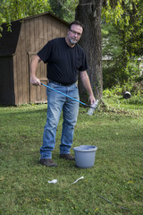 Picking Up A Plastic Bottle With Pick Up Tool