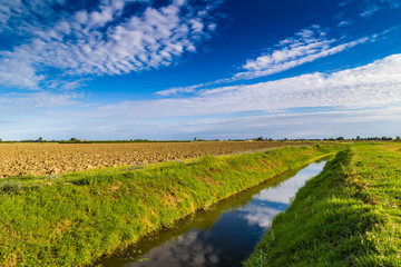 Naklejka premium irrigation canal in Italian countryside