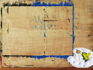 wooden easel with art palette
