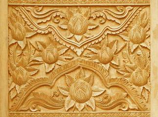 Flower carved on wood panels.