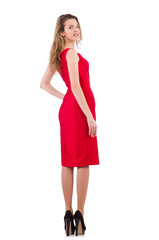 Young woman in red dress isolated on white