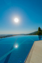 Fototapeta premium Infinity pool on the bright summer day