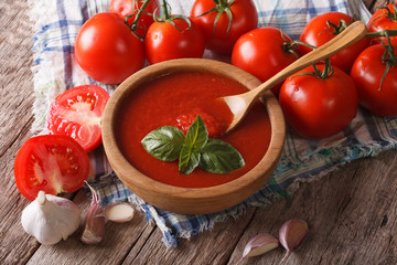 Homemade tomato sauce with garlic and basil closeup. Horizontal
