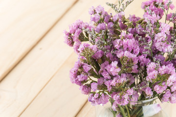 statice flower bouquet  on wood background