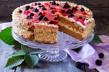 Cake, souffle and berry jelly on the wooden table