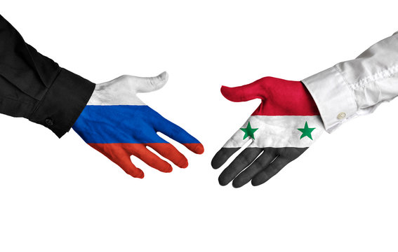 Russia and Syria leaders shaking hands on a deal agreement