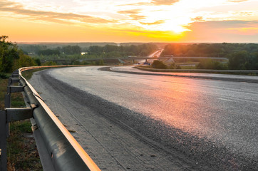 Road descending from the hill , bridge