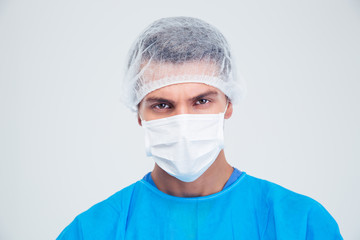 Portrait of a serious surgeon looking at camera