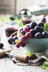 Red wine and grape on the wooden table