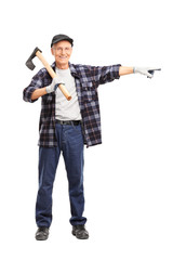 Full length portrait of a senior man holding an axe and pointing