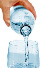 Drinking water pouring from bottle to glass