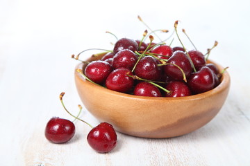Ripe cherry in a wooden bowl