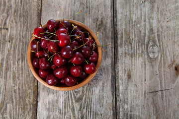 Ripe cherry in a wooden bowl