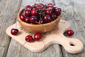 Ripe cherry in a wooden bowl