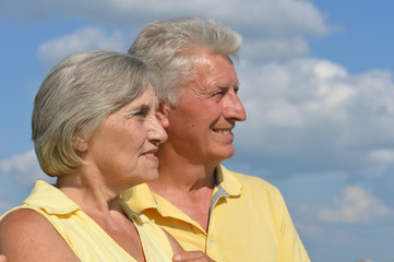 Senior couple on a sky background