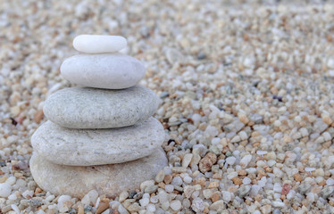 Fototapeta na wymiar Stack of zen stones on beach