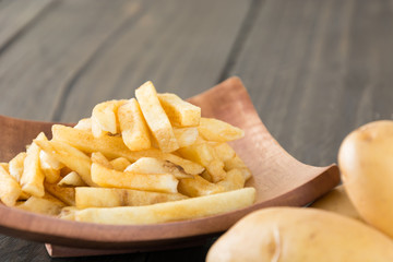 french fries on wood background