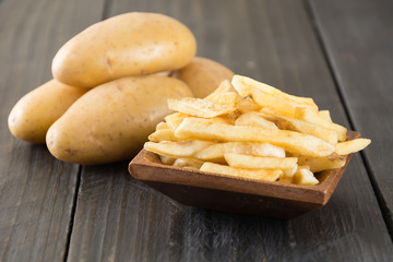 french fries on wood background