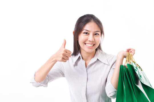 shopping woman showing thumb up gesture