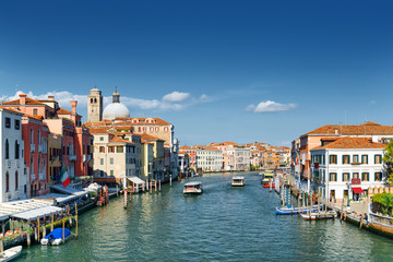 Fototapeta na wymiar Water buses rides along the Grand Canal in Venice, Italy