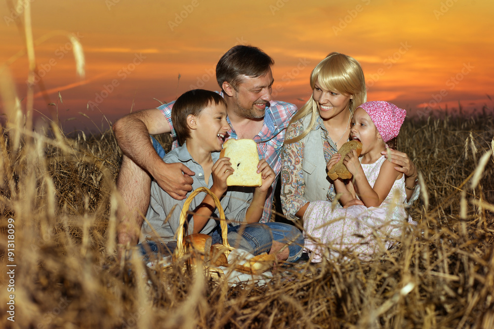 Wall mural happy family in wheat field