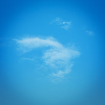 blue sky weather background with single white clouds