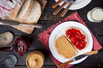Peanut butter and jelly sandwich on a rustic table