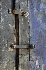 Padlocks on an old wooden door