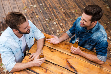 Enjoying beer with friend.