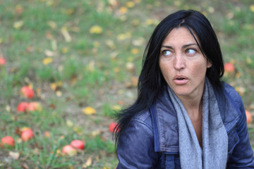 Portrait of a beautiful girl in forest apples