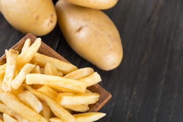 french fries on wood background