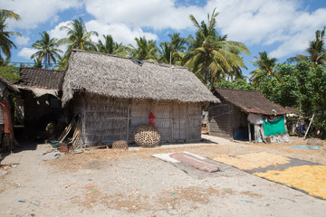 Plakat poor huts of the natives, Nusa Penida, Prov. Bali. Indonesia