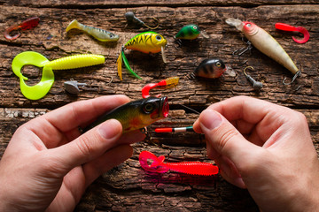 man holding a fishing bait and fishing line © itakdalee