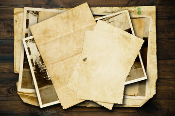 Vintage background with old paper and letters on wood