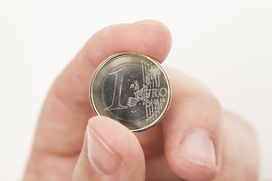 1 Euro Münzen in Hand
